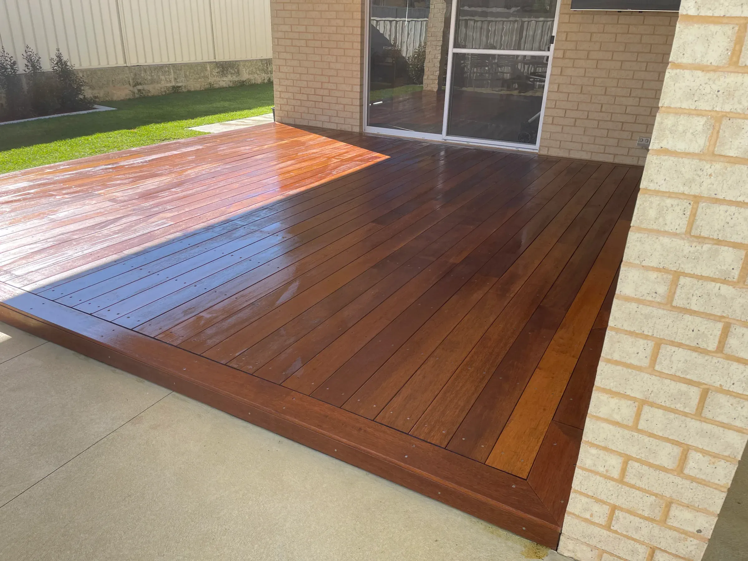 Close view of jarrah deck boards and the picture-frame border at the edge